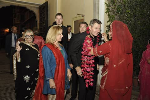 Garland welcome continues; Gayle in blue with red shawl
