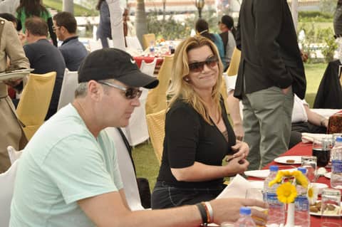 Lunch at an outdoor table, two guests in sunglasses