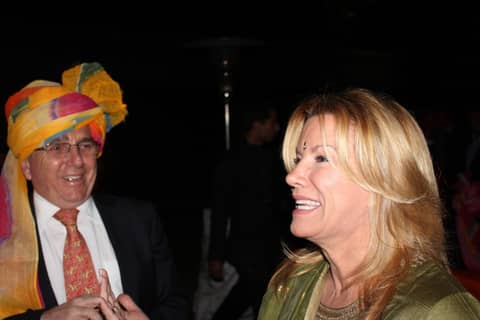 Man in turban and Gayle talking, close