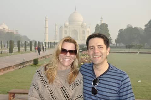 Taj Mahal: Gayle in sunglasses and man in striped sweater, close two-shot