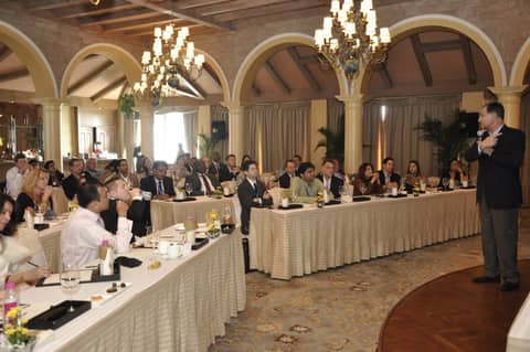 Conference hall with chandeliers, long tables of classmates