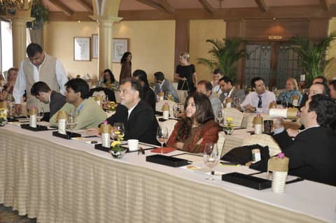 Conference session, classmates at tables