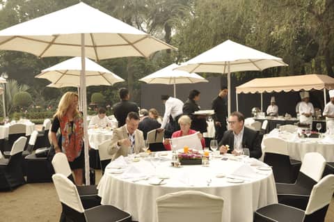 Outdoor lunch under white parasols