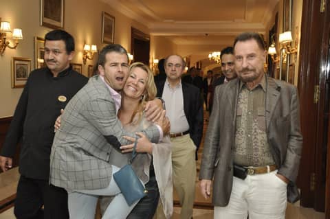 Guests embracing in a hallway