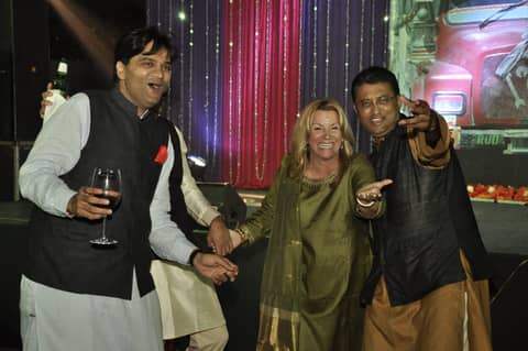 Gayle dancing with two men