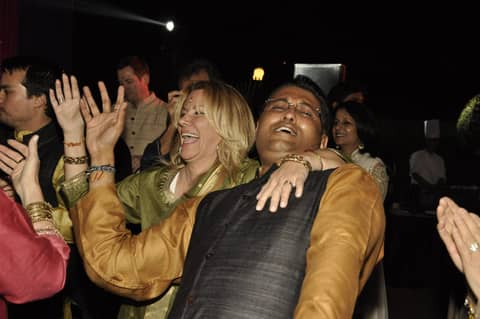 Gayle and man dancing, laughing