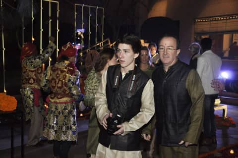 Two men in Indian vests at the party