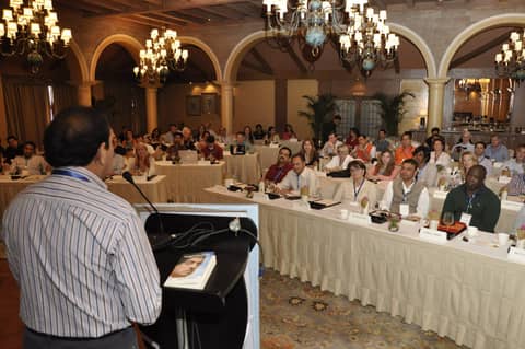 Speaker at lectern facing the hall