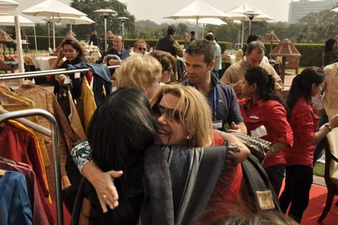 Gayle hugging another woman at the market