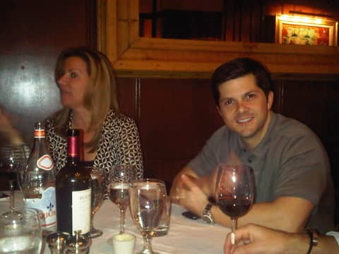 Restaurant: Gayle and man at table with wine