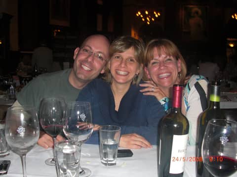 Three friends at table, close
